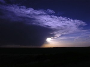 A storm in Kansas ploughs across a field. ([Photo by Kirsten Koza)