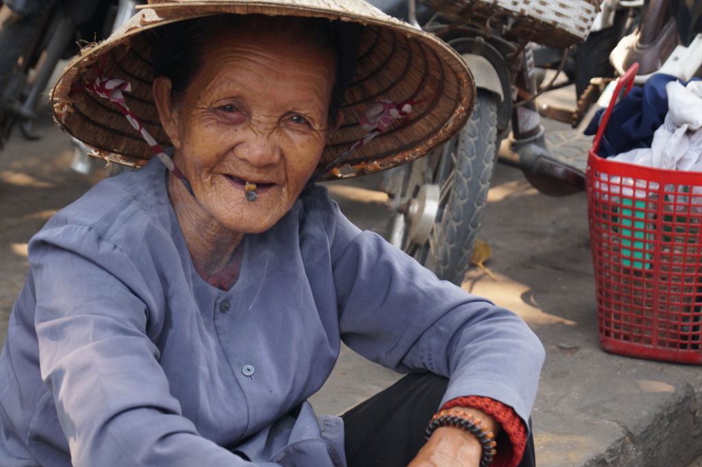 Local lady smoking something she rolled herself, Hoi An, Vietnam. (Photo by Kirsten Koza, Writers' Expeditions)