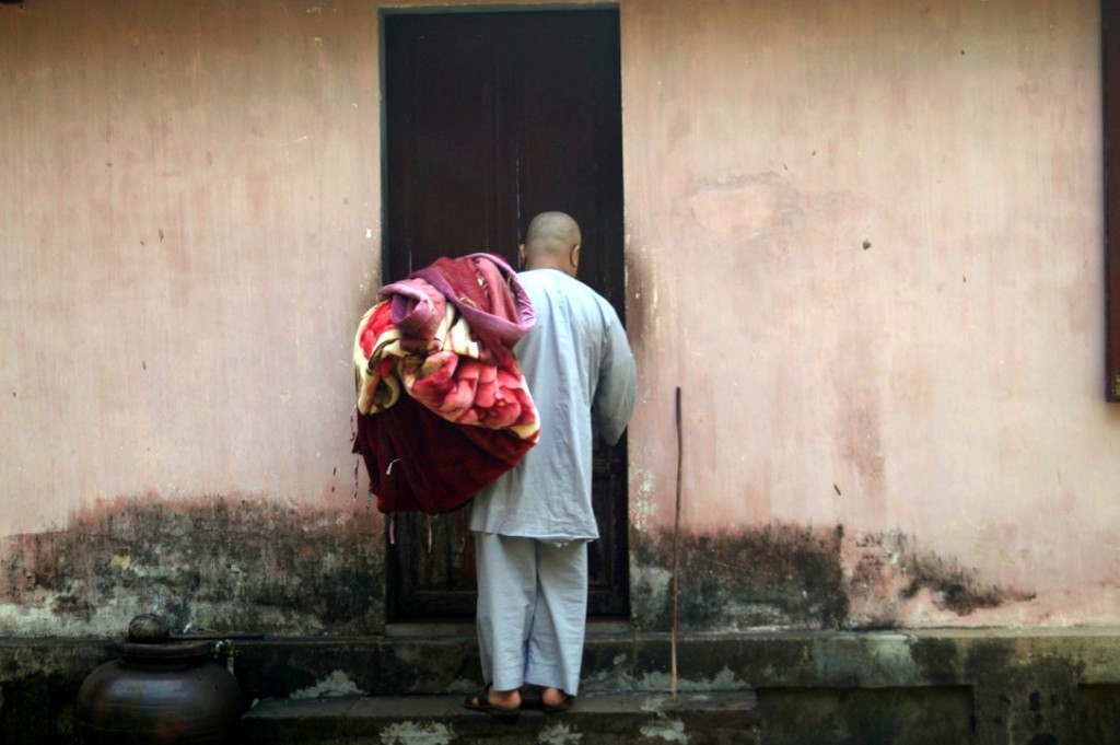 Monk at side entrance, at Thien Mu Pagoda, Hue. (Photo by Kirsten Koza,  Writers' Expeditions)