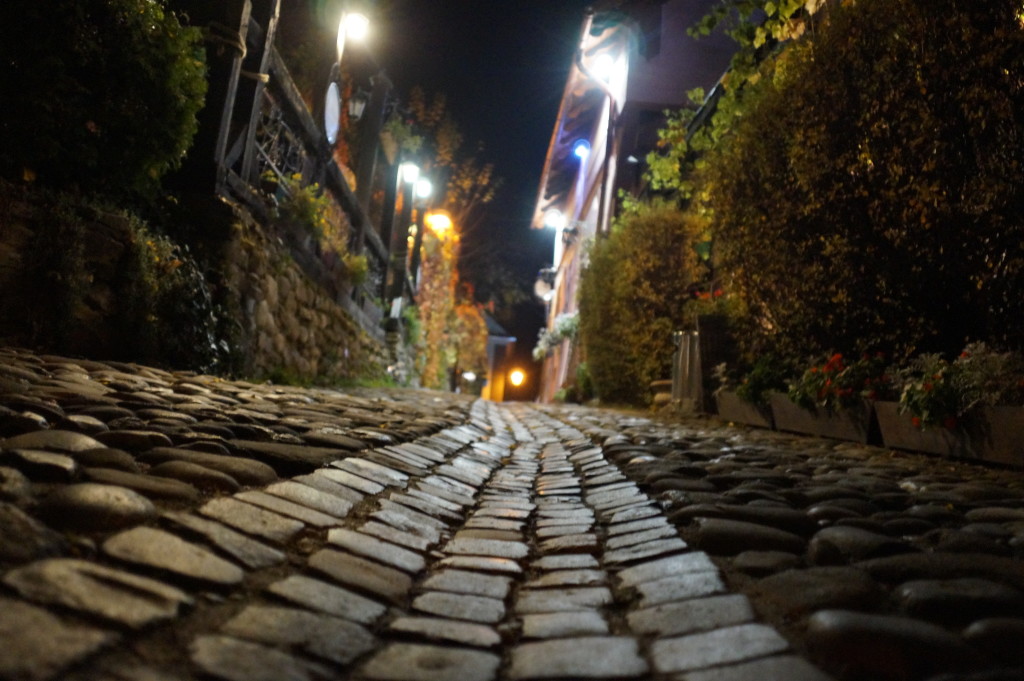 Night shot on the cobbled medieval streets of Sighisoara, Romania. (Photo by Kirsten Koza, travel author and host of the Vlad Dracula Expedition)